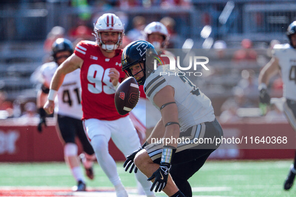 Purdue defensive back Dillon Thieneman #31 fumbles a punt against the Wisconsin Badgers at Camp Randall Stadium in Madison, Wisconsin, on Oc...