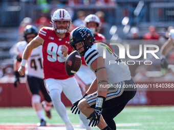 Purdue defensive back Dillon Thieneman #31 fumbles a punt against the Wisconsin Badgers at Camp Randall Stadium in Madison, Wisconsin, on Oc...