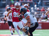 Purdue defensive back Dillon Thieneman #31 fumbles a punt against the Wisconsin Badgers at Camp Randall Stadium in Madison, Wisconsin, on Oc...