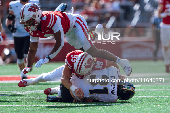 Purdue defensive back Dillon Thieneman #31 fumbles a punt against the Wisconsin Badgers at Camp Randall Stadium in Madison, Wisconsin, on Oc...