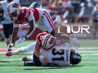 Purdue defensive back Dillon Thieneman #31 fumbles a punt against the Wisconsin Badgers at Camp Randall Stadium in Madison, Wisconsin, on Oc...