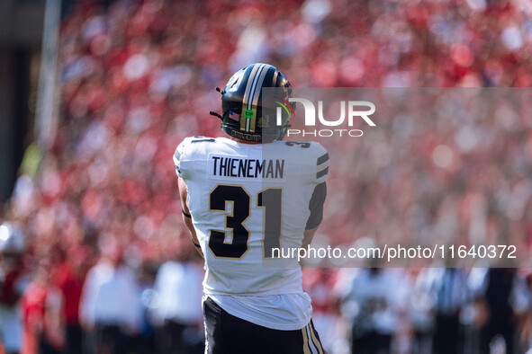 Purdue defensive back Dillon Thieneman #31 fumbles a second punt against the Wisconsin Badgers at Camp Randall Stadium in Madison, Wisconsin...