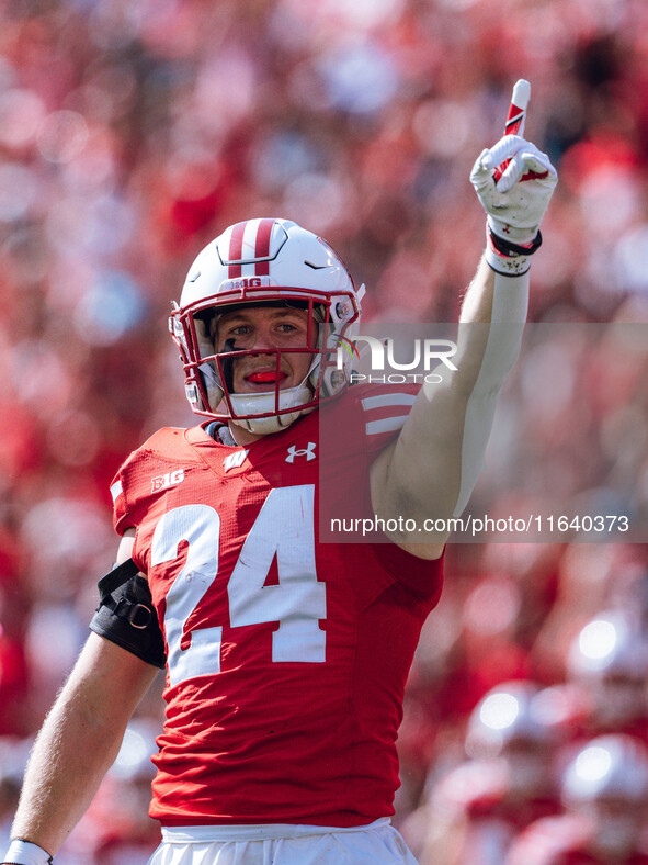 Wisconsin Badgers safety Hunter Wohler #24 celebrates a fumble recovery on special teams against the Purdue Boilermakers at Camp Randall Sta...