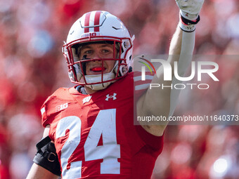 Wisconsin Badgers safety Hunter Wohler #24 celebrates a fumble recovery on special teams against the Purdue Boilermakers at Camp Randall Sta...