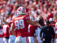 Wisconsin Badgers safety Cayson Pfeiffer #99 recovers a fumbled punt against the Purdue Boilermakers at Camp Randall Stadium in Madison, Wis...