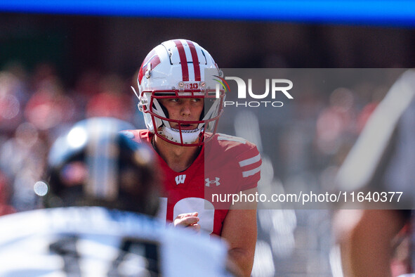 Wisconsin Badgers quarterback Braedyn Locke #18 observes the Purdue Boilermakers defense at Camp Randall Stadium in Madison, Wisconsin, on O...