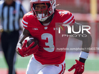 Wisconsin Badgers running back Tawee Walker #3 runs in a touchdown against the Purdue Boilermakers at Camp Randall Stadium in Madison, Wisco...