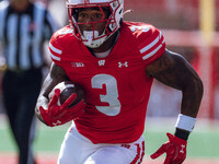 Wisconsin Badgers running back Tawee Walker #3 runs in a touchdown against the Purdue Boilermakers at Camp Randall Stadium in Madison, Wisco...