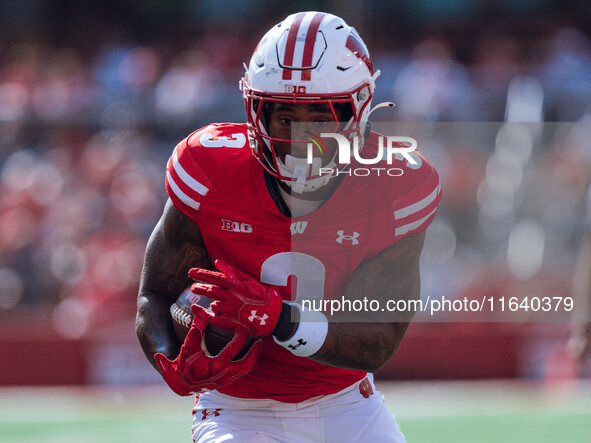 Wisconsin Badgers running back Tawee Walker #3 runs in a touchdown against the Purdue Boilermakers at Camp Randall Stadium in Madison, Wisco...