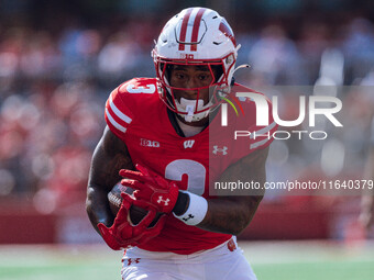 Wisconsin Badgers running back Tawee Walker #3 runs in a touchdown against the Purdue Boilermakers at Camp Randall Stadium in Madison, Wisco...