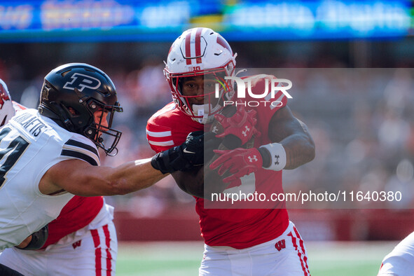 Wisconsin Badgers running back Tawee Walker #3 runs in a touchdown against the Purdue Boilermakers at Camp Randall Stadium in Madison, Wisco...