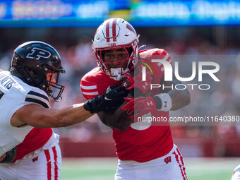 Wisconsin Badgers running back Tawee Walker #3 runs in a touchdown against the Purdue Boilermakers at Camp Randall Stadium in Madison, Wisco...