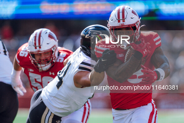 Wisconsin Badgers running back Tawee Walker #3 runs in a touchdown against the Purdue Boilermakers at Camp Randall Stadium in Madison, Wisco...