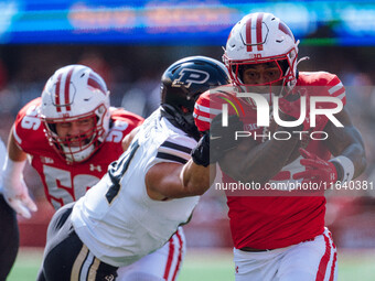 Wisconsin Badgers running back Tawee Walker #3 runs in a touchdown against the Purdue Boilermakers at Camp Randall Stadium in Madison, Wisco...