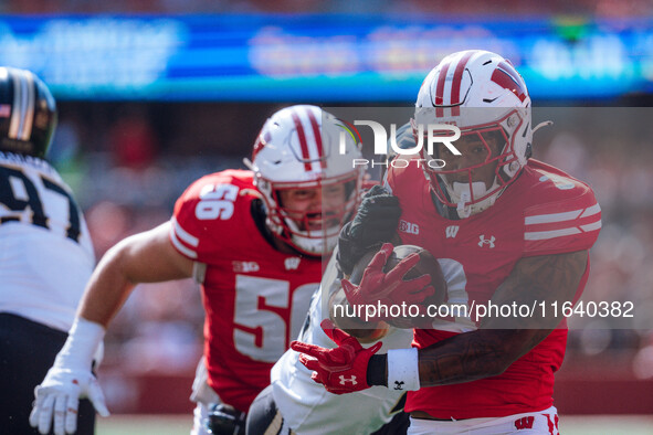 Wisconsin Badgers running back Tawee Walker #3 runs in a touchdown against the Purdue Boilermakers at Camp Randall Stadium in Madison, Wisco...