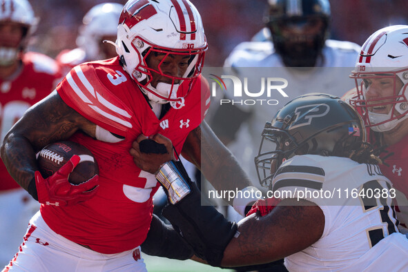 Wisconsin Badgers running back Tawee Walker #3 runs in a touchdown against the Purdue Boilermakers at Camp Randall Stadium in Madison, Wisco...