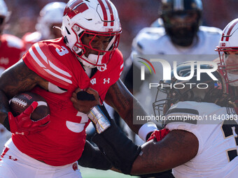 Wisconsin Badgers running back Tawee Walker #3 runs in a touchdown against the Purdue Boilermakers at Camp Randall Stadium in Madison, Wisco...