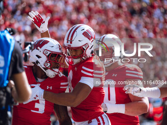 Wisconsin Badgers wide receiver C.J. Williams #4 celebrates a Tawee Walker #3 touchdown against the Purdue Boilermakers at Camp Randall Stad...