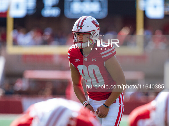 Wisconsin Badgers kicker Nathanial Vakos #90 lines up an extra point against the Purdue Boilermakers at Camp Randall Stadium in Madison, Wis...