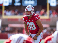 Wisconsin Badgers kicker Nathanial Vakos #90 lines up an extra point against the Purdue Boilermakers at Camp Randall Stadium in Madison, Wis...