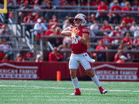 Wisconsin Badgers quarterback Braedyn Locke #18 throws a pass against the Purdue Boilermakers at Camp Randall Stadium in Madison, Wisconsin,...