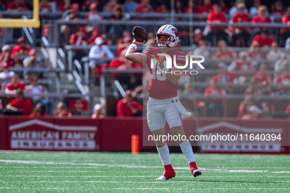 Wisconsin Badgers quarterback Braedyn Locke #18 throws a pass against the Purdue Boilermakers at Camp Randall Stadium in Madison, Wisconsin,...