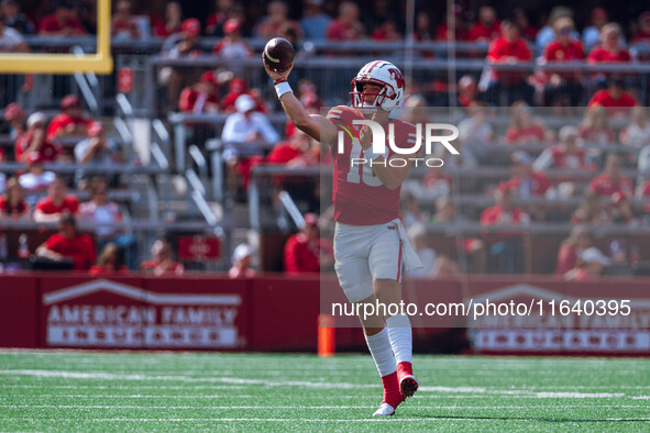 Wisconsin Badgers quarterback Braedyn Locke #18 throws a pass against the Purdue Boilermakers at Camp Randall Stadium in Madison, Wisconsin,...