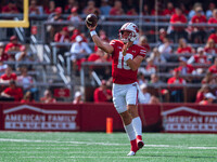 Wisconsin Badgers quarterback Braedyn Locke #18 throws a pass against the Purdue Boilermakers at Camp Randall Stadium in Madison, Wisconsin,...