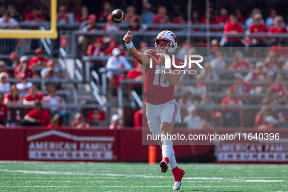 Wisconsin Badgers quarterback Braedyn Locke #18 throws a pass against the Purdue Boilermakers at Camp Randall Stadium in Madison, Wisconsin,...