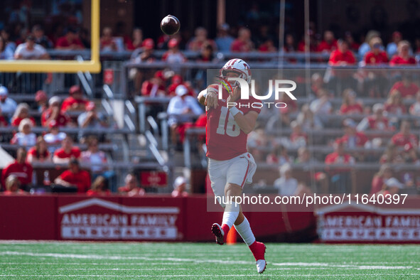 Wisconsin Badgers quarterback Braedyn Locke #18 throws a pass against the Purdue Boilermakers at Camp Randall Stadium in Madison, Wisconsin,...