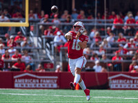 Wisconsin Badgers quarterback Braedyn Locke #18 throws a pass against the Purdue Boilermakers at Camp Randall Stadium in Madison, Wisconsin,...