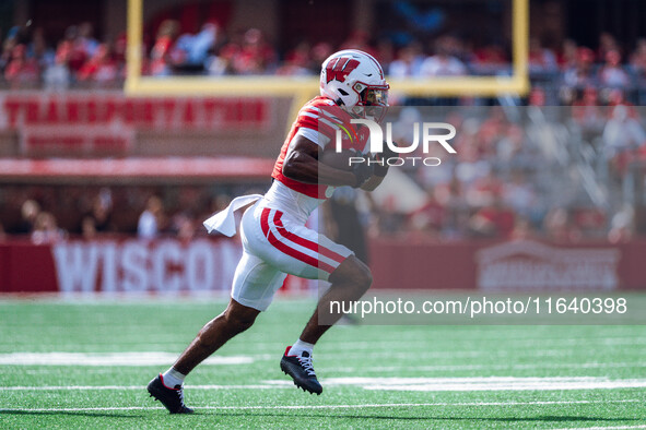 Wisconsin Badgers wide receiver Vinny Anthony II #8 outruns the Purdue Boilermakers for a touchdown at Camp Randall Stadium in Madison, Wisc...