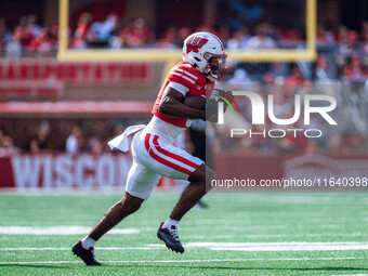 Wisconsin Badgers wide receiver Vinny Anthony II #8 outruns the Purdue Boilermakers for a touchdown at Camp Randall Stadium in Madison, Wisc...