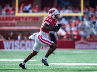 Wisconsin Badgers wide receiver Vinny Anthony II #8 outruns the Purdue Boilermakers for a touchdown at Camp Randall Stadium in Madison, Wisc...