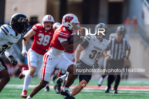 Wisconsin Badgers wide receiver Vinny Anthony II #8 outruns the Purdue Boilermakers for a touchdown at Camp Randall Stadium in Madison, Wisc...