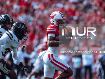 Wisconsin Badgers wide receiver Vinny Anthony II #8 outruns the Purdue Boilermakers for a touchdown at Camp Randall Stadium in Madison, Wisc...