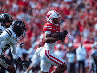 Wisconsin Badgers wide receiver Vinny Anthony II #8 outruns the Purdue Boilermakers for a touchdown at Camp Randall Stadium in Madison, Wisc...