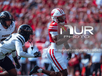 Wisconsin Badgers wide receiver Vinny Anthony II #8 outruns the Purdue Boilermakers for a touchdown at Camp Randall Stadium in Madison, Wisc...