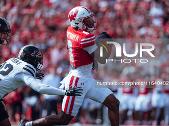 Wisconsin Badgers wide receiver Vinny Anthony II #8 outruns the Purdue Boilermakers for a touchdown at Camp Randall Stadium in Madison, Wisc...