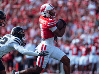 Wisconsin Badgers wide receiver Vinny Anthony II #8 outruns the Purdue Boilermakers for a touchdown at Camp Randall Stadium in Madison, Wisc...