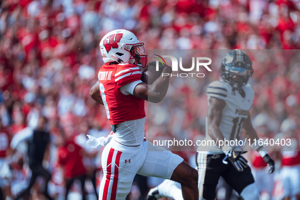 Wisconsin Badgers wide receiver Vinny Anthony II #8 outruns the Purdue Boilermakers for a touchdown at Camp Randall Stadium in Madison, Wisc...