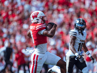 Wisconsin Badgers wide receiver Vinny Anthony II #8 outruns the Purdue Boilermakers for a touchdown at Camp Randall Stadium in Madison, Wisc...