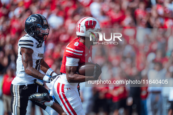 Wisconsin Badgers wide receiver Vinny Anthony II #8 outruns the Purdue Boilermakers for a touchdown at Camp Randall Stadium in Madison, Wisc...