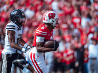 Wisconsin Badgers wide receiver Vinny Anthony II #8 outruns the Purdue Boilermakers for a touchdown at Camp Randall Stadium in Madison, Wisc...