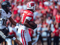 Wisconsin Badgers wide receiver Vinny Anthony II #8 outruns the Purdue Boilermakers for a touchdown at Camp Randall Stadium in Madison, Wisc...