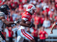 Wisconsin Badgers wide receiver Vinny Anthony II #8 outruns the Purdue Boilermakers for a touchdown at Camp Randall Stadium in Madison, Wisc...