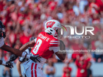 Wisconsin Badgers wide receiver Vinny Anthony II #8 outruns the Purdue Boilermakers for a touchdown at Camp Randall Stadium in Madison, Wisc...