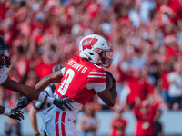 Wisconsin Badgers wide receiver Vinny Anthony II #8 outruns the Purdue Boilermakers for a touchdown at Camp Randall Stadium in Madison, Wisc...