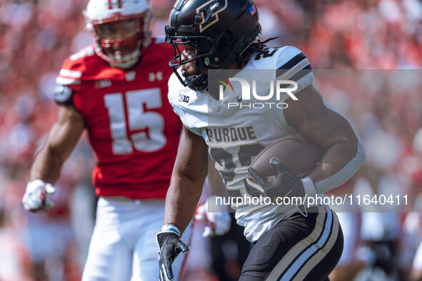 Purdue running back Reggie Love III #23 runs the ball against the Wisconsin Badgers at Camp Randall Stadium in Madison, Wisconsin, on Octobe...