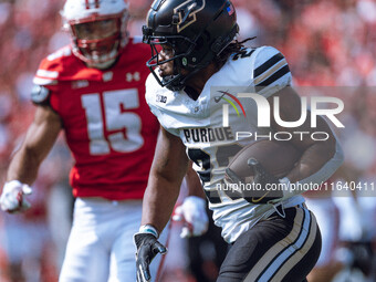 Purdue running back Reggie Love III #23 runs the ball against the Wisconsin Badgers at Camp Randall Stadium in Madison, Wisconsin, on Octobe...